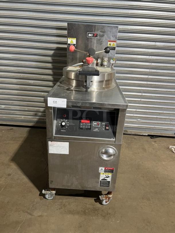 BKI 2015 LPF-F commercial stainless steel pressure fryer, electric, color-keyed locking spindle, lid-lock system, on casters.