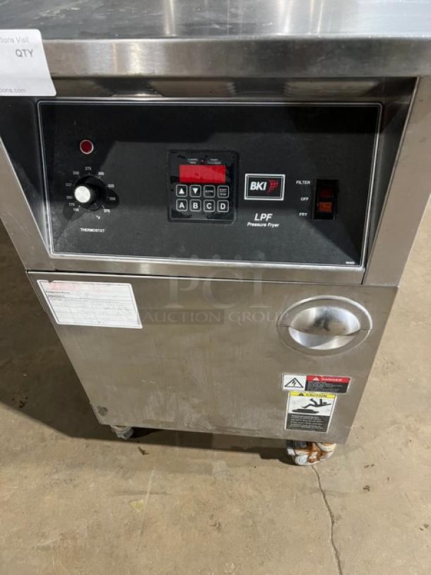 BKI LPF-F late model stainless steel electric pressure fryer, 2015. Features locking spindle, lid-lock system, 208V 3-phase, on casters.