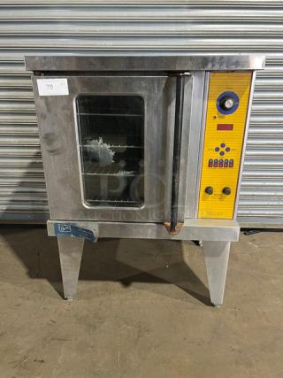 Duke commercial stainless steel electric convection oven with wired oven rack, single stacked, on legs, visible control panel.