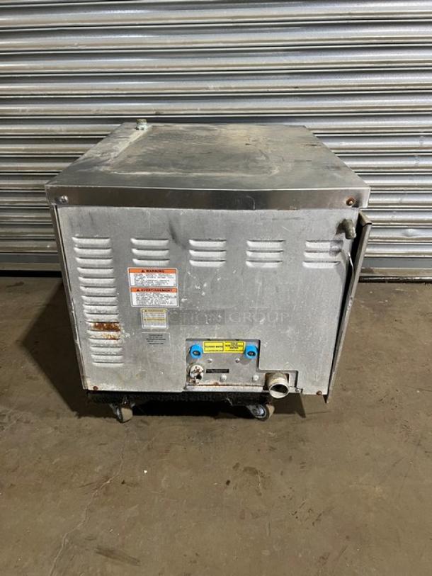 Vulcan C24EA3 stainless steel electric countertop 3-pan convection steamer, with built-in universal pan rack, visible wear.