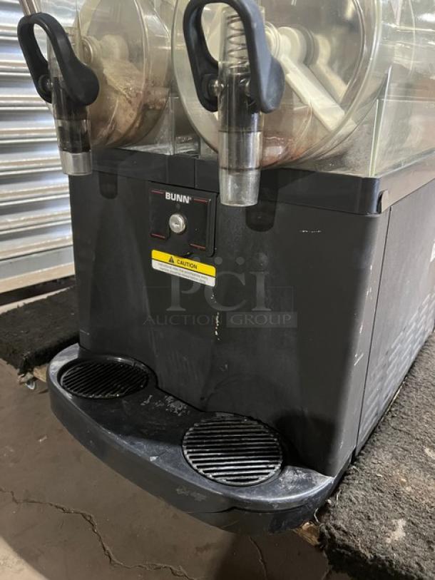 Bunn CDS2 twin gourmet ice slushy machine with dual 3-gal hoppers and drip tray. Stainless steel. Model: CDS2 SN: CDS0042242. 120V 1 Phase.