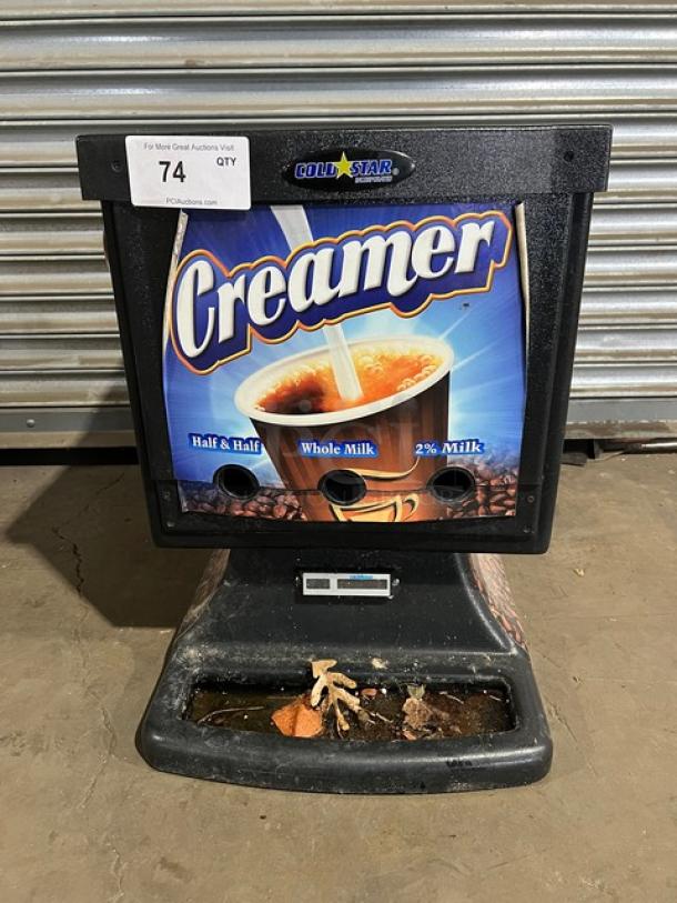 Cold Star ND3R 3-flavor electric milk/cream dispenser, black, countertop model, 120V. Shows minor wear with visible signage.