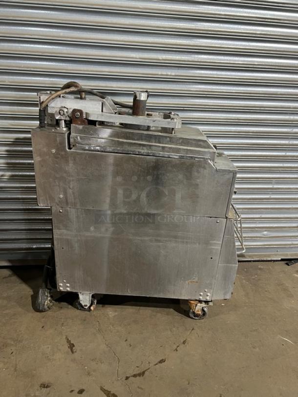 Garland CXBE12 stainless steel electric hamburger press with wavy grates, on casters, model CXBE12, 208V, 3 phase.