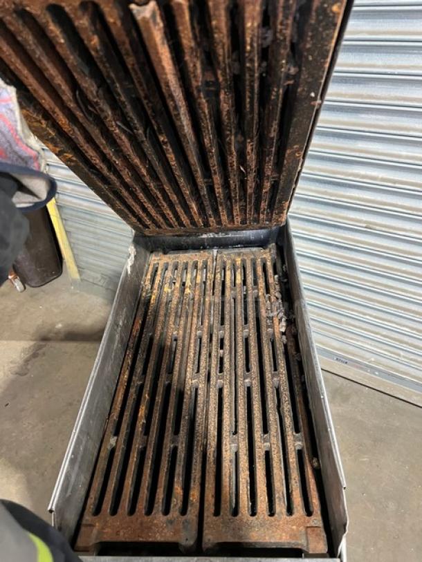 Garland CXBE12 dual-side hamburger press with wavy grates, showing rust and wear. Stainless steel, 208V, 3-phase, on casters.