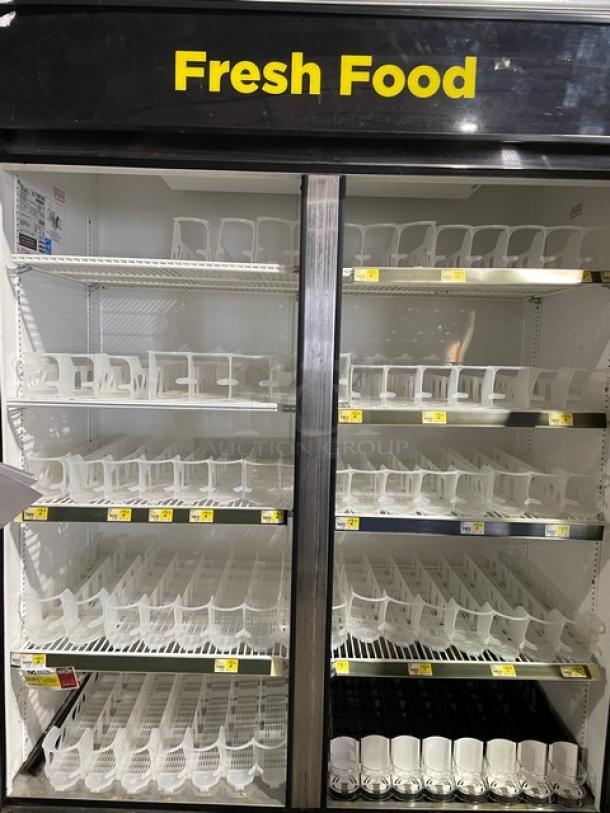 True GDM-49 double glass door merchandiser refrigerator with poly coated racks, energy-efficient, black and white, beverage organizers.