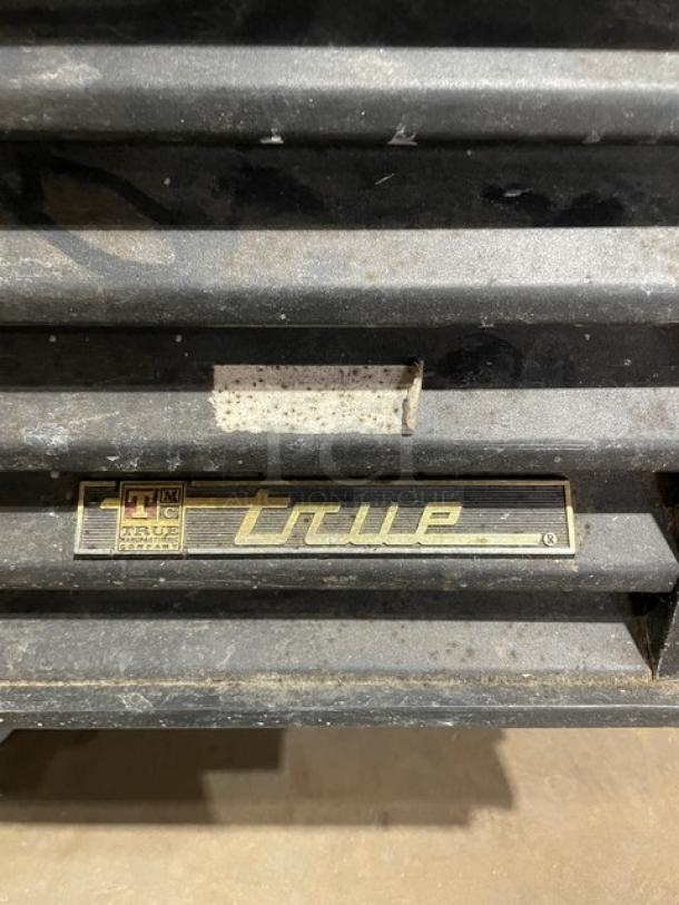 True GDM-49 reach-in merchandiser refrigerator, Energy Star certified, with beverage organizers and poly-coated wired rack.