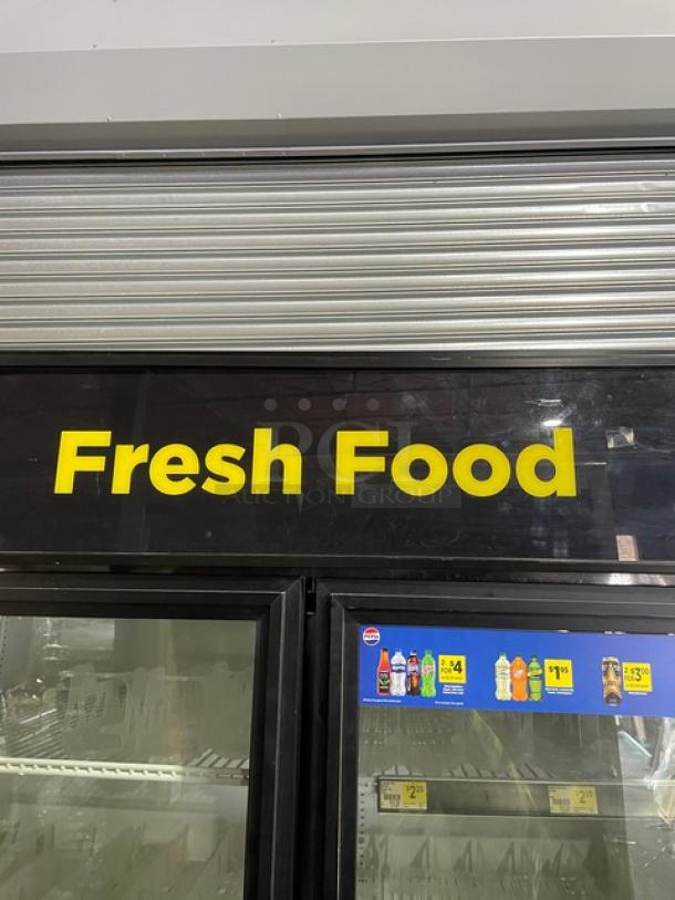 True GDM-49 black & white double glass swing door refrigerator, Energy Star certified, poly coated wire rack, beverage organizers.