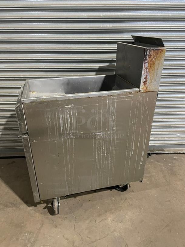 Asber commercial stainless steel natural gas fryer, model AEF4050SENG, with back splash, on casters, shows wear and residue.