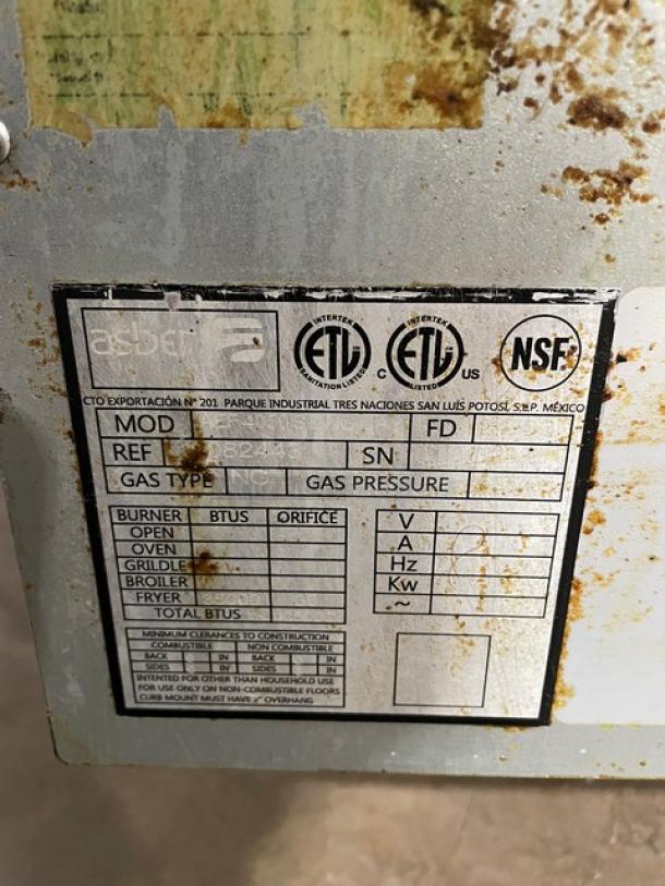 Label on Asber AEF-4050-S-E-NG deep fat fryer showing certification marks and specifications. Slight rust visible.