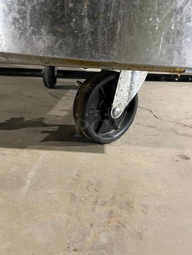 Asber commercial stainless steel deep fat fryer AEF4050SENG on casters, featuring a back splash, for natural gas use.