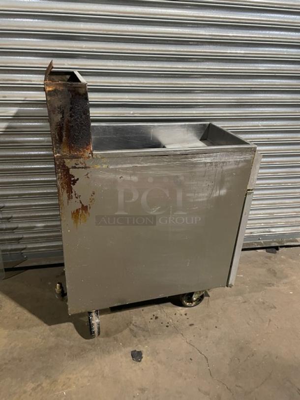 Asber AEF-4050-S-E-NG commercial deep fat fryer, stainless steel, natural gas, 40/50 lb capacity, rusty back splash, on casters.
