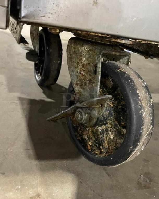 Asber commercial deep fat fryer with back splash, model AEF-4050-S-E-NG, natural gas, on worn casters.