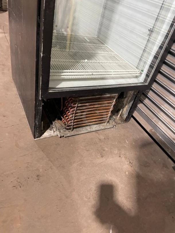 Beverage-Air MT27 commercial merchandiser refrigerator, black, single glass swing door, poly coated wire rack, visible wear.