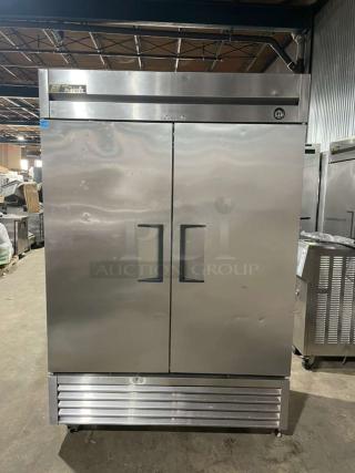 True T-49F commercial 2-door stainless steel reach-in freezer, Energy Star certified, with poly-coated wire rack, on casters.