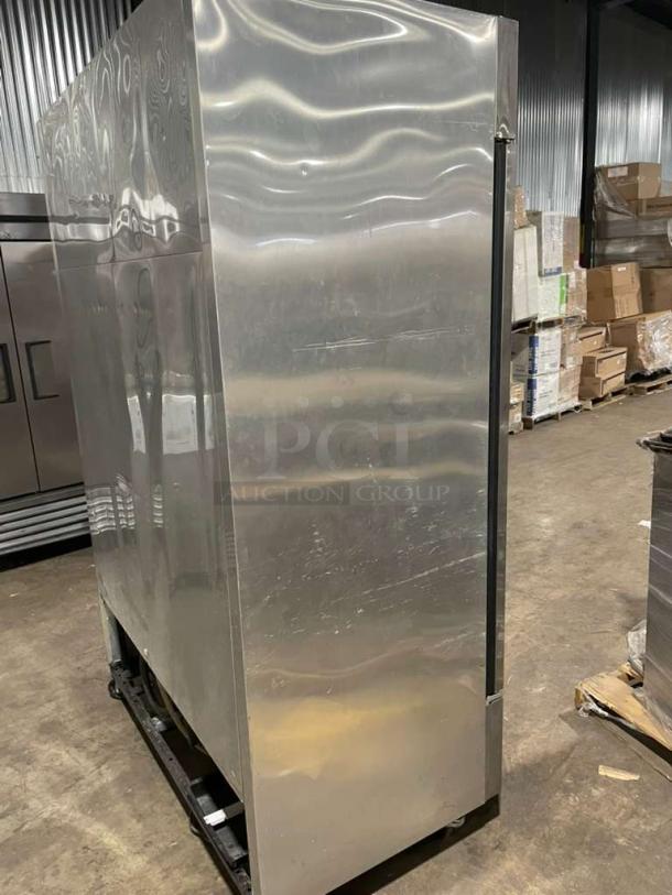 True T49F 2-door stainless steel commercial freezer on casters, Energy Star certified, with poly-coated wire racks.