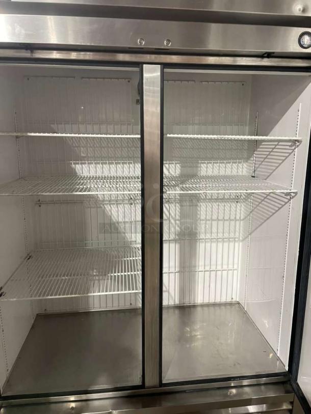 True T-49F stainless steel 2-door reach-in freezer, Energy Star certified, with poly coated wired racks, on casters.