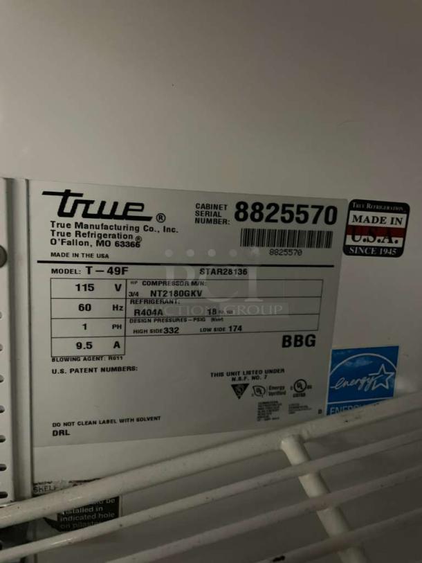 True T-49F Commercial Stainless Steel 2-Door Reach-In Freezer, Energy Star Certified, with Poly Coated Wired Rack. Model: T-49F, 115V, 1 Phase, on casters. Serial Number: 8825570.
