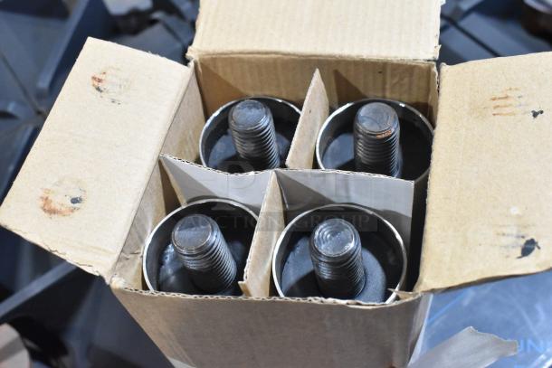 Cardboard box containing four metal threaded components with black bases, organized in separate sections.
