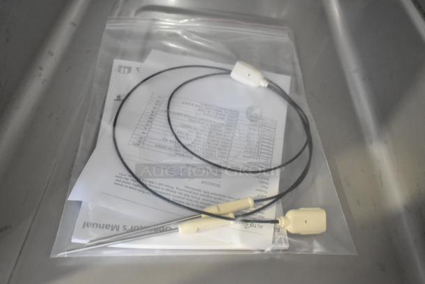 Packet with Alto Shaam oven manual and cables, part of the 2025 Alto Shaam 1200-TH stainless steel commercial oven package.