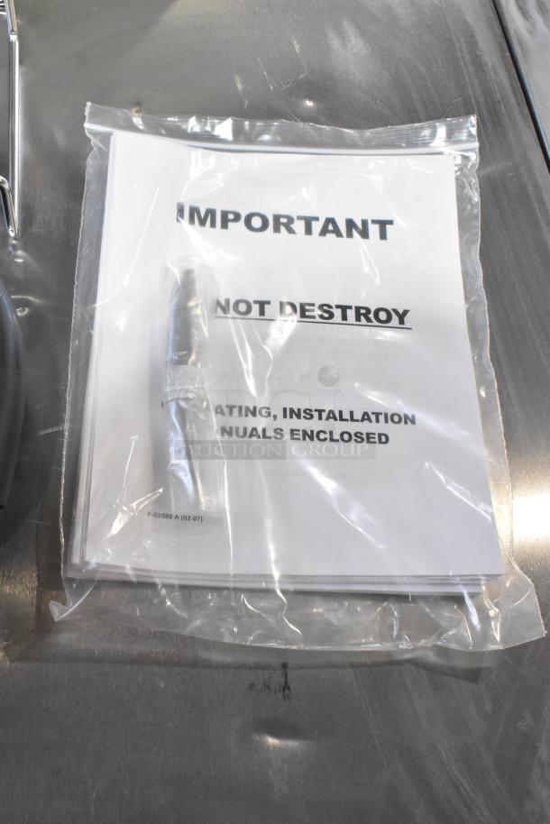 Brand new 2024 Vulcan MDMT-20 stainless steel 20-gallon tilting kettle, with manual labeled "Important, Do Not Destroy."