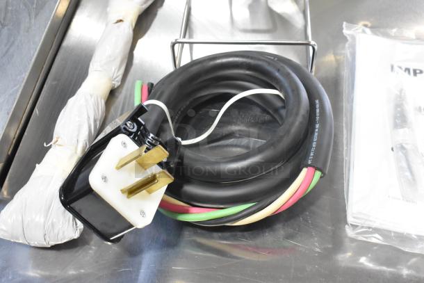 Bundle of cables and plug for a 2024 Vulcan MDMT-20 stainless steel commercial 20-gallon tilting kettle.