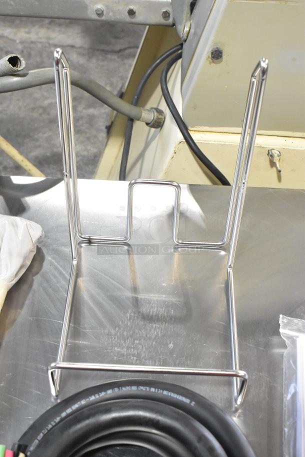 Brand new Vulcan MDMT-20 stainless steel 20-gallon tilting kettle, commercial floor style, shown with metal stand and cables.