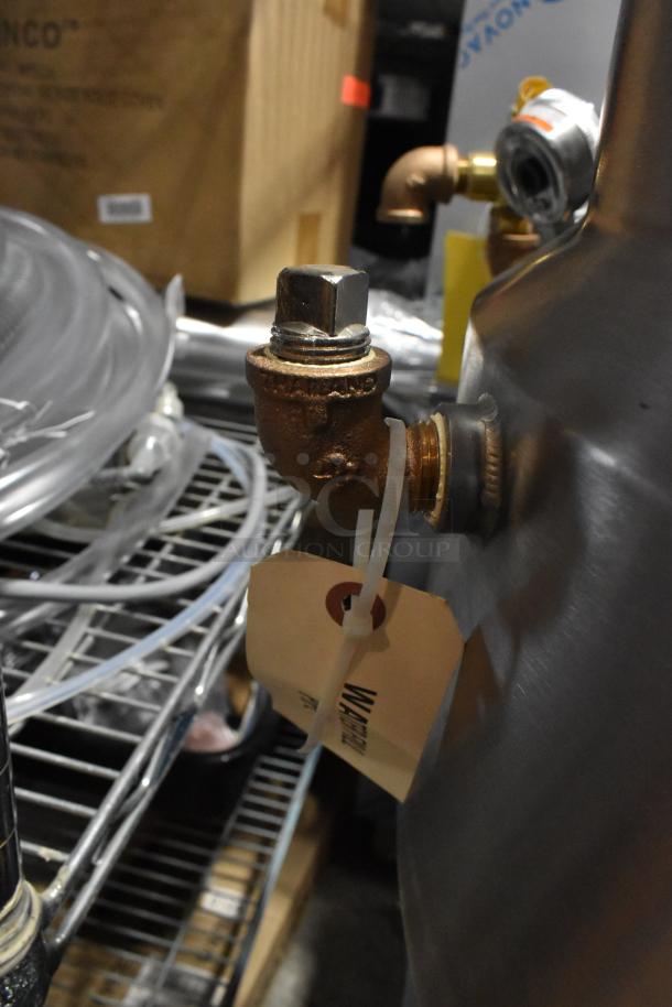 Stainless steel 2024 Vulcan MDMT-20 20-gallon tilting kettle. New condition, visible tag. Ideal for commercial use.