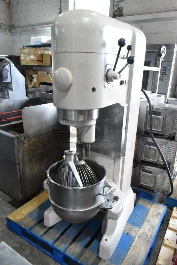 Hobart M-802 80-quart commercial dough mixer with mixing bowl, whisk, and paddle on a pallet. 208V, 3-phase power.