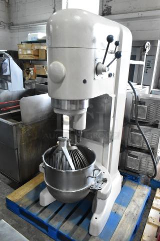 Hobart M-802 80-quart commercial dough mixer with mixing bowl, whisk, and paddle on a pallet. 208V, 3-phase power.
