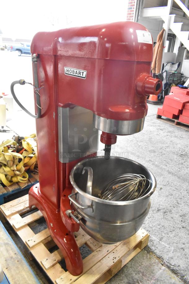 Hobart H-600T 60 qt commercial dough mixer with metal bowl, whisk, and dough hook, 208V 3-phase, red body, on pallet.