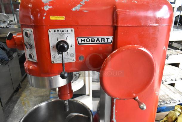 Hobart H-600T red commercial 60-quart dough mixer with mixing bowl, whisk, and dough hook; 208V, 3-phase; visible wear.