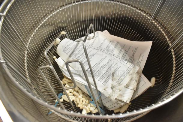 Groen TDH-48C stainless steel 12-gallon steam tilting kettle; interior shown with documents and packing material inside.