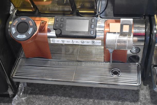 Thermoplan Mastrena II espresso machine, stainless steel, automatic, with steam wand, controls, and markings visible, used condition.