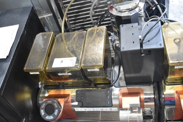 Thermoplan Mastrena II stainless steel commercial espresso machine with steam wand, bean hoppers labeled Cream, Signature, Blonde.