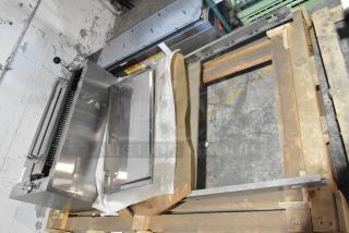 Brand new Jade Range gas-powered cheese melter attachment with back splash, in original packaging, stainless steel finish.