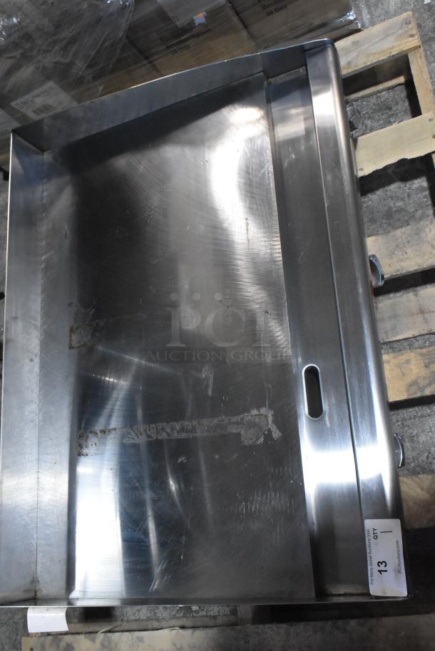 Brand new Star Max stainless steel commercial countertop gas griddle, pristine condition, on wooden pallet.