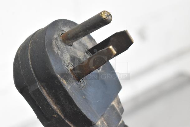 Close-up of a three-prong power plug for the Autofry MTI-40C countertop ventless fryer. Plug shows some wear.
