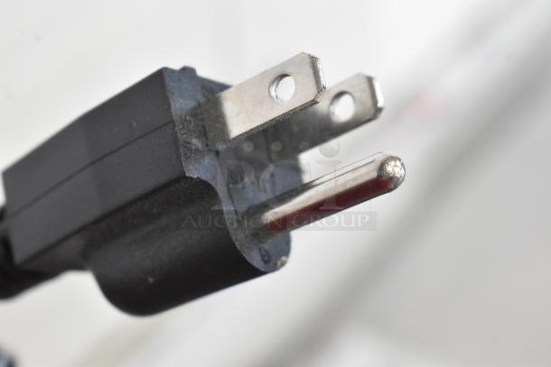Close-up of a power plug for the Vevor NB-RGG-001 Commercial Food Warmer, showing standard prongs.