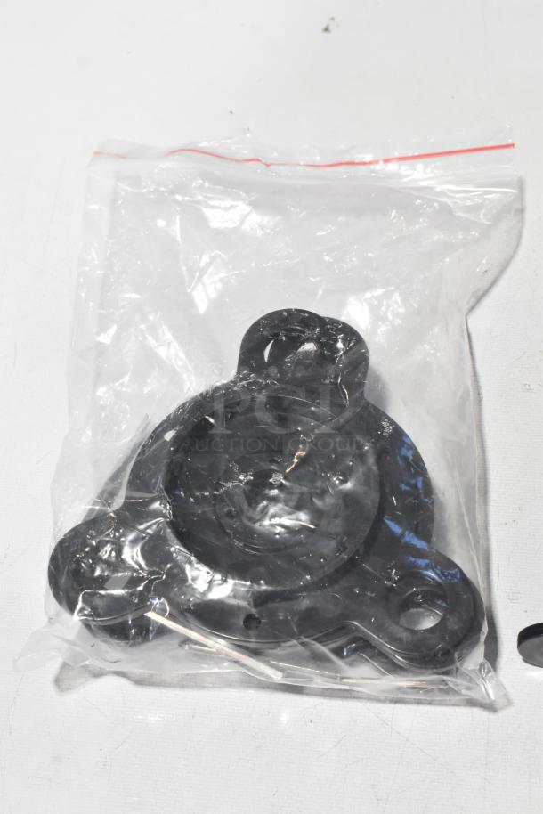 Sealed black plastic component for a Metal Countertop Microcomputer Automatic Sealer in a clear plastic bag.