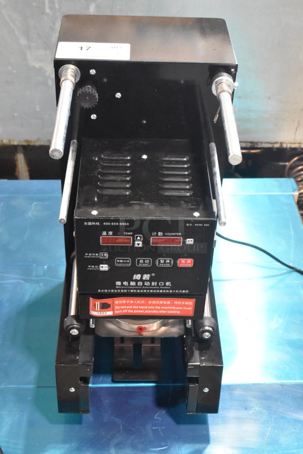 Metal countertop microcomputer automatic sealer, 115 volts, 1 phase. Features control panel, temperature and counter displays, safety warnings.