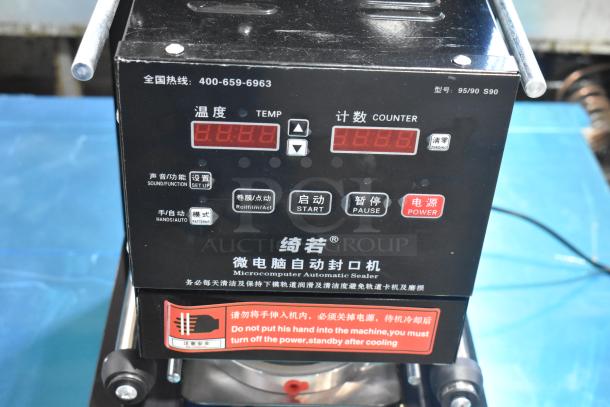 Metal countertop microcomputer automatic sealer, black, model 95/90 S90. Features temperature and counter displays, 115 volts, 1 phase.