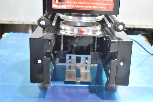 Metal Countertop Microcomputer Automatic Sealer, 115 Volts, 1 Phase, black finish, visible safety warning label.