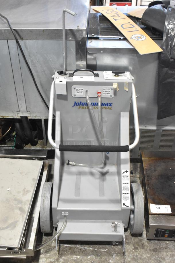 Johnson Wax Professional JWP-1572 metal floor waxing machine, gray, visible tubes and control panel, in used condition.