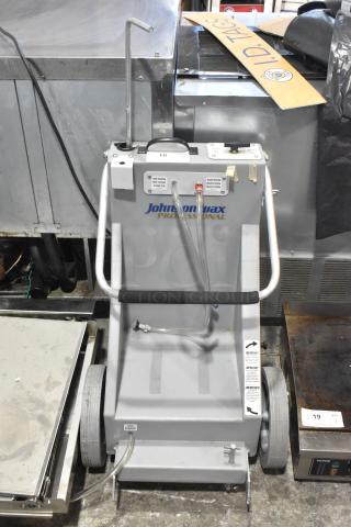 Johnson Wax Professional JWP-1572 metal floor waxing machine, gray, visible tubes and control panel, in used condition.