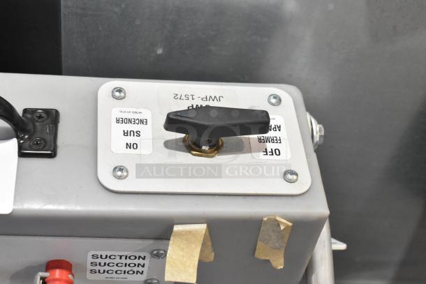 Johnson Wax Professional JWP-1572 metal floor waxing machine control panel with labels for suction and on/off switch.