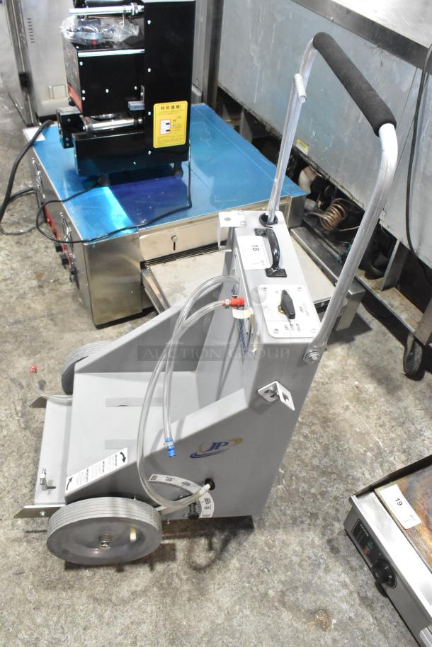 Johnson Wax Professional JWP-1572 floor waxing machine, gray metal with tubing and control panel, in good condition.