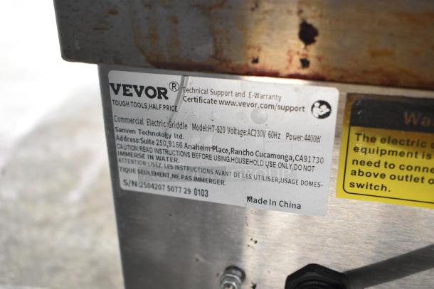 Vevor HT-820 stainless steel griddle label; 230V, 60Hz, 4400W. Made in China. Model and caution details visible.