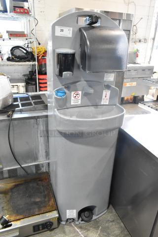 Polyjohn gray portable hand washing station, features soap dispenser and towel holder, pre-owned, good condition.