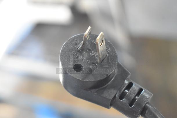 Close-up of the electrical plug for a 2019 Delfield 406P-STAR2 stainless steel undercounter cooler, 115 volts, 1 phase.