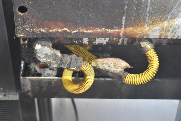 Royal stainless steel gas-powered commercial griddle on stand, showing rust and wear on parts. Suitable for refurbishment.